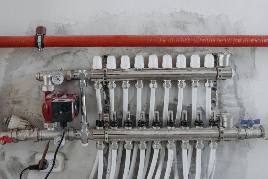 Pipe fittings and valves used in a plumbing installation.